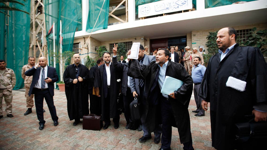 Libyan lawyers celebrate after the court invalidated the country's parliament, outside the Supreme Court in Tripoli, Nov. 6, 2014. (Reuters)