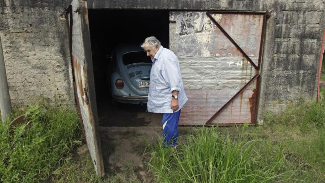 Uruguay's President José Mujica walks in front of his garage on his farm on the outskirts of Montevideo, Feb. 13, 2014. Reuters