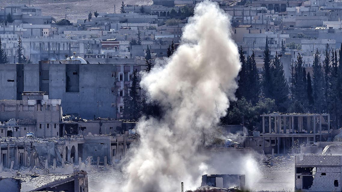 A picture taken on November 6, 2014 from the Turkish city of Mursitpinar shows smoke rising during a shelling by Islamic State militants to the Syrian city of Kobane,