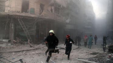  Emergency responders rush following a reported barrel bomb attack by government forces in the Al-Muasalat area in the northern Syrian city of Aleppo on November 6, 2014. (File photo: AFP)