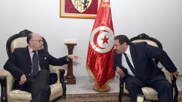		 TUNISIA-FRANCE-POLITICS-DIPLOMACY, MOY Tunisia's Minister of Interior, Lotfi Ben Jeddou (R) smiles with his French counterpart Bernard Cazeneuve (L) in Tunis on November 10, 2014.