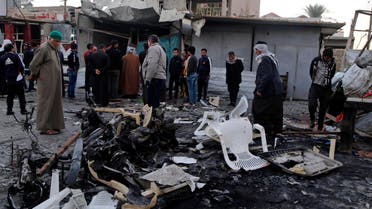 People gather at the site of a car bomb attack in Baghdad's Sadr City, November 9, 2014. (Reuters)