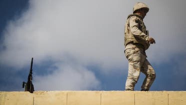 An Egyptian soldier stands guard along the Rafah border with Israel on July 19, 2014. AFP 