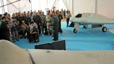 Iran's Supreme Leader Ayatollah Ali Khamenei sitting next to a captured U.S. RQ-170 drone that crashed in Iran on December 2011, and its locally made copy. (File photo:AFP)