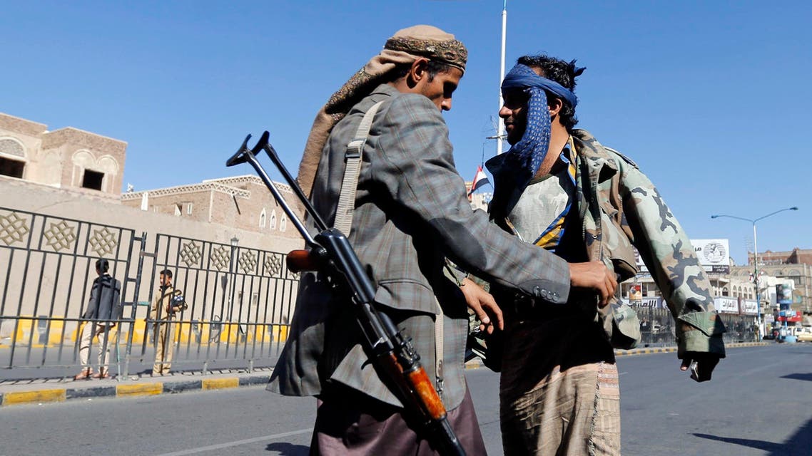 A Shi'ite Houthi rebel searches a man at a checkpoint in Sanaa November 4, 2014. An advance into Yemen's Sunni Muslim heartland by Shi'ite Houthi fighters has galvanised support for al Qaeda among some Sunnis, deepening the religious hue of the country's many conflicts, with potential consequences well beyond its borders.