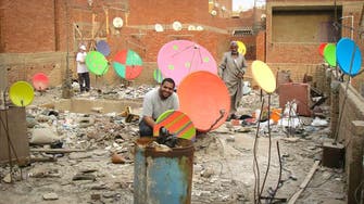 Coloring Cairo: Artists on quest to paint city’s satellite dishes