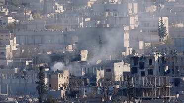 A view shows smoke raising from an eastern Kobani neighbourhood, damaged by fighting between Islamic State militants and Kurdish forces, November 18, 2014. Picture taken from the Turkish side of the Turkey-Syria border. REUTERS/Osman Orsal (SYRIA - Tags: CONFLICT CIVIL UNREST)