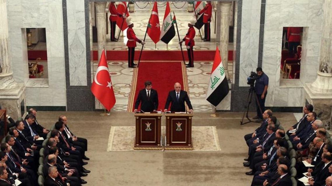 أوغلو والعبادي في بغداد