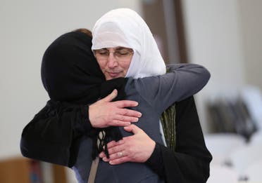 Paula Kassig is consoled by a friend following a prayer service in memory of her son Abdul-Rahman Kassig, whose name was Peter before his conversion to Islam, in Fishers, Indiana, November 21, 2014. The parents of an American aid worker beheaded by Islamic State militants after his abduction in Syria attended a Muslim prayer service held in their son's honor in Indiana. Kassig was the fifth European or American captive killed by the militants. His severed head was seen in a video that was released on November 16 and also showed the beheadings of at least 14 men. REUTERS/Chris Bergin (UNITED STATES - Tags: OBITUARY POLITICS)