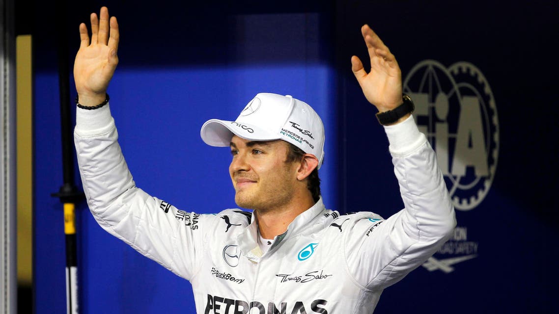Mercedes Formula One driver Nico Rosberg of Germany waves after winning the pole position for the Abu Dhabi F1 Grand Prix at the Yas Marina circuit in Abu Dhabi November 22, 2014. (Reuters)