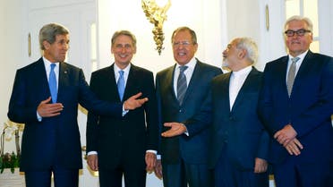 U.S. Secretary of State John Kerry, Britain's Foreign Secretary Philip Hammond, Russian Foreign Minister Sergei Lavrov, Iranian Foreign Minister Javad Zarif and German Foreign Minister Frank-Walter Steinmeier (L to R) pose for photographers before a meeting in Vienna Nov. 24, 2014. (Reuters)