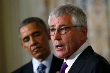 U.S. President Barack Obama (L) listens to Defense Secretary Chuck Hagel after the president announced Hagel's resignation at the White House in Washington, November 24, 2014. (Reuters)
