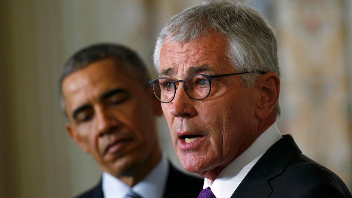 U.S. President Barack Obama (L) listens to Defense Secretary Chuck Hagel after the president announced Hagel's resignation at the White House in Washington, November 24, 2014. (Reuters)