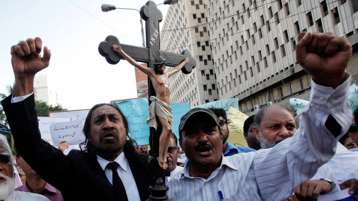 Members of the Pakistani Christian community chant slogans during a demonstration to condemn the death of a Christian couple in a village in Punjab province on Tuesday, in Karachi Nov. 6, 2014. (Reuters)