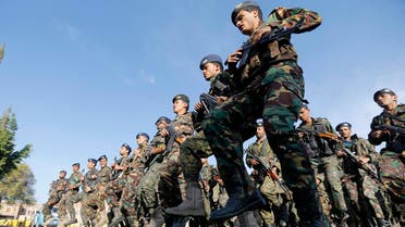 Police troopers march during a funeral procession for a fellow police trooper and an army officer, killed by al Qaeda in recent attacks, in Sanaa Nov. 19, 2014. (Reuters)