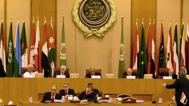 Palestinian president Mahmud Abbas (C-L) seen attending an extraordinary Arab League meeting to discuss the situation in the Palestinian territories, in Cairo on November 29, 2014. (AFP)