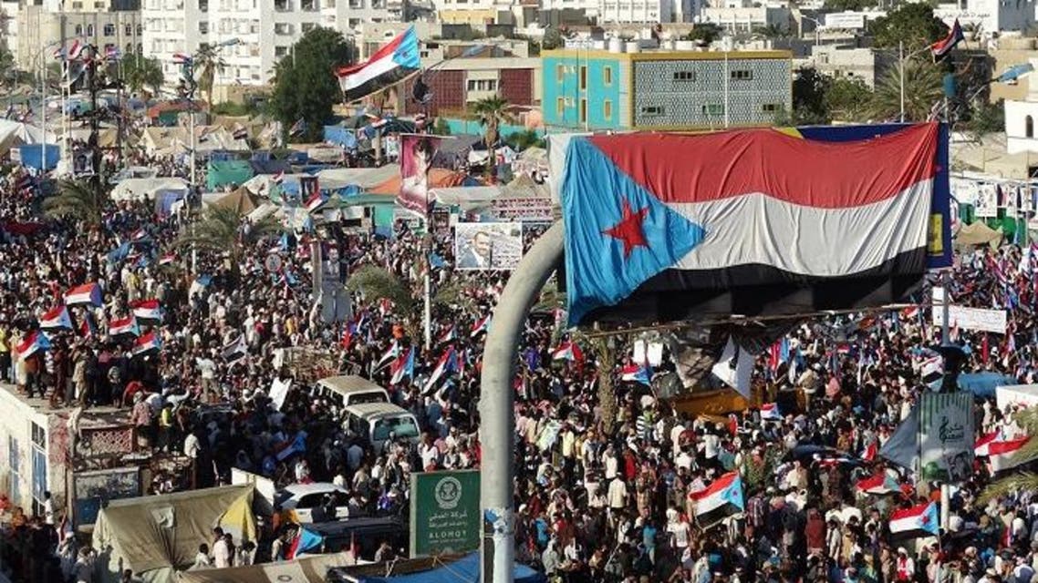 Yemani protesters wave flags and march through the streets during a demonstration demanding renewed independence in the southern city of Aden on Nov. 30, 2014. (AFP)