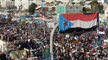 Yemani protesters wave flags and march through the streets during a demonstration demanding renewed independence in the southern city of Aden on Nov. 30, 2014. (AFP)
