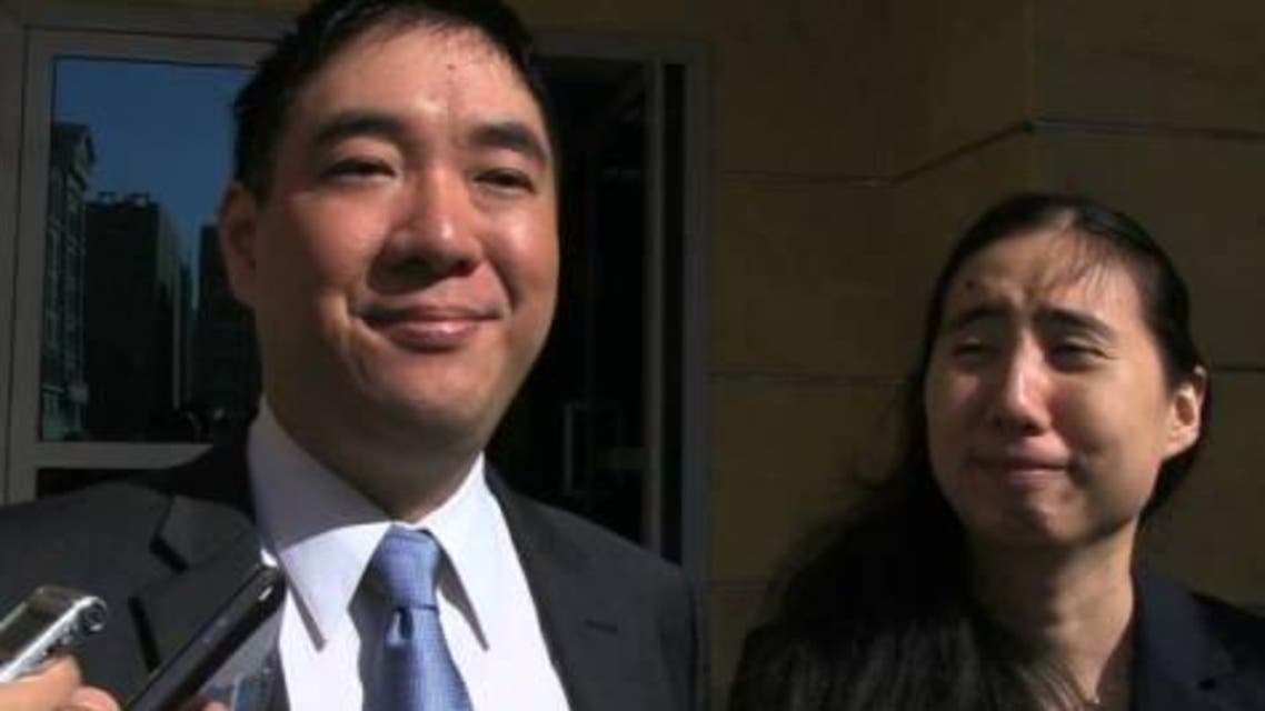 AFP The Huangs spent months behind bars before being let out on their own recognizance last November.