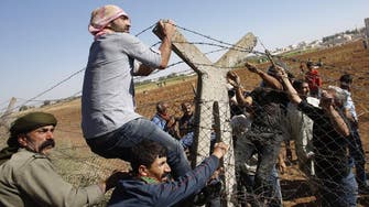 Thousands of Syrian refugees stranded in Turkish minefield