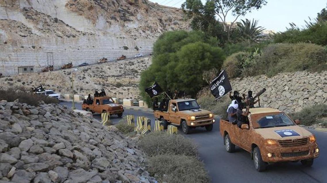 n armed motorcade belonging to members of Derna's Islamic Youth Council proceeds along a road in Derna, eastern Libya, Oct. 3, 2014. The group pledged allegiance to the Islamic State group fighting in Syria and Iraq.