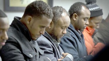 Men gather to pray the day after 15-year-old Abdisamad Sheikh-Hussein was struck and killed. (Photo courtesy: AP)