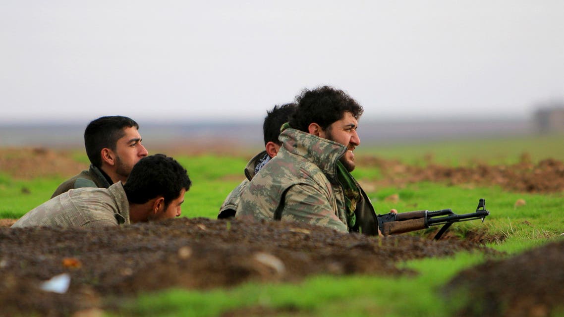 Fighters of the Kurdish People's Protection Units (YPG) take positions in a trench at the frontline against ISIS fighters in the southern countryside of Ras al-Ain December 7, 2014. (Reuters)