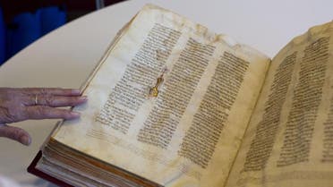 A library official shows a Jewish manuscript smuggled into Israel from Damascus in a Mossad spy operation in the early 1990s. (File photo: AP)
