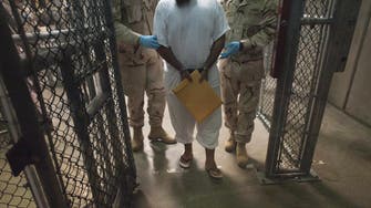 Obama blasts Guantanamo provision as he signs defense bill 