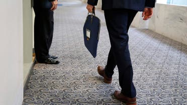 A U.S. Senate Intelligence Committee staff member enters the committee's offices with a secure attache case on Capitol Hill in Washington in this July 31, 2014 file photo.  (Reuters)