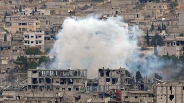 Smoke raises from central Kobani, where buildings have been damaged in fighting between Islamic State militants and Kurdish forces, November 23, 2014. reuters