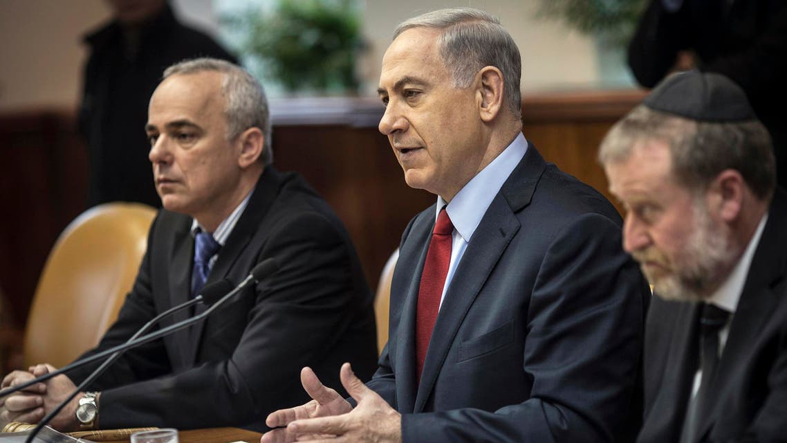 Israel's Prime Minister Benjamin Netanyahu (C) and Strategic Affairs Minister Yuval Steinitz (L) attend the weekly cabinet meeting in Jerusalem December 14, 2014. (Reuters)