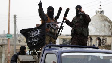 Members of al Qaeda's Nusra Front gesture as they drive in a convoy touring villages, which they said they have seized control of from Syrian rebel factions, in the southern countryside of Idlib, December 2, 2014. Reuters