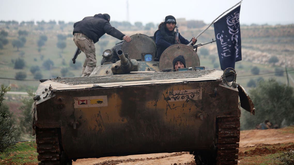 Fighters from the Al-Nusra Front, Al-Qaeda's Syria branch, drive a tank they seized from forces loyal to the regime as they fight against them on December 19, 2014 in the southern countryside of Syria's northern city of Aleppo. AFP