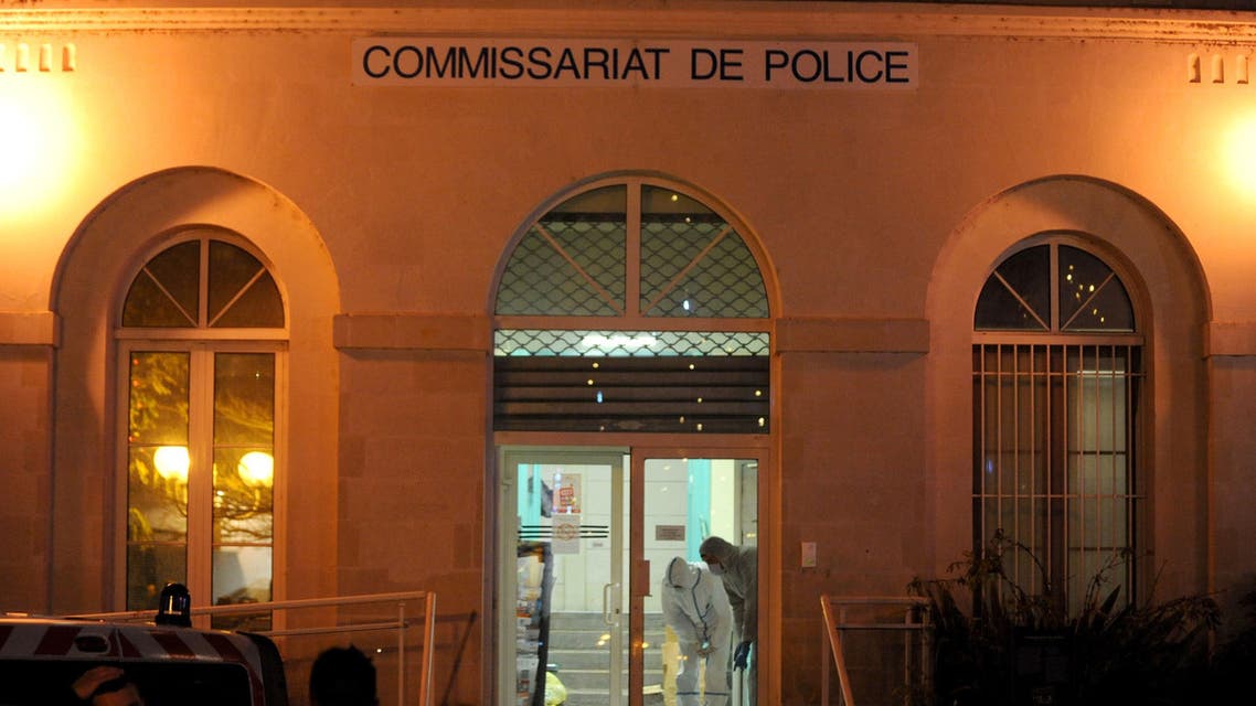 Forensic police collect evidence inside the police station of Joue les-Tours on December 20, 2014 where French police shot dead a man who attacked them with a knife in a police station while shouting "Allahu Akbar" ("God is great" in Arabic). (AFP)