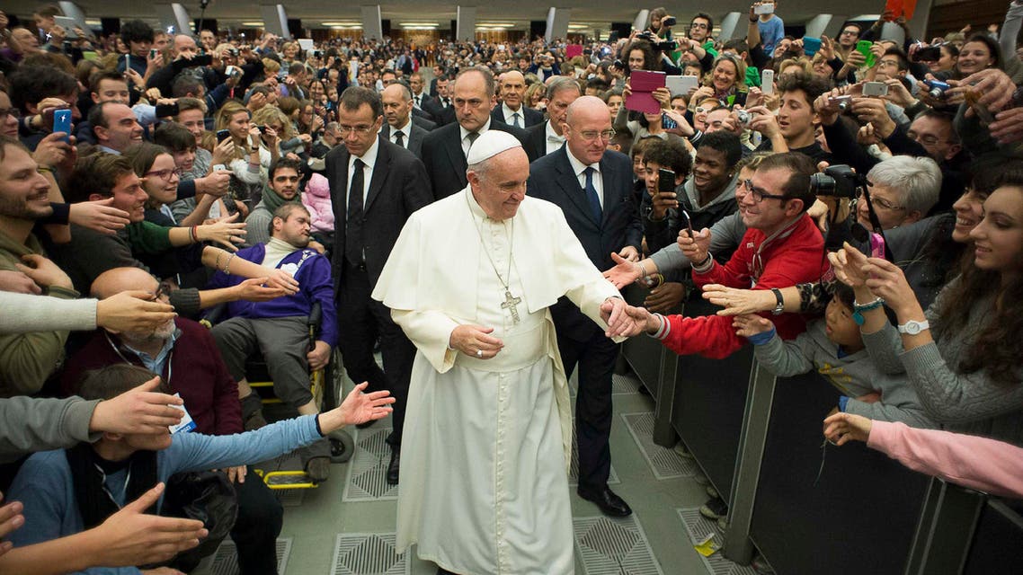 Pope Francis interacts with the faithful of the Pope John XXIII Community at a meeting in Paul VI hall at the Vatican December 20, 2014. (Reuters)