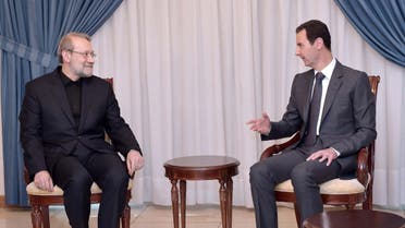 Syria's President Bashar al-Assad (R) meets Iranian Parliament Speaker Ali Larijani in Damascus December 21, 2014. (Reuters)