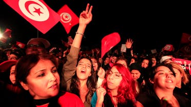 Supporters of the Nidaa Tounes (Call for Tunisia) secular party movement wave flags and shout slogans in Tunis December 21, 2014.  (Reuters)
