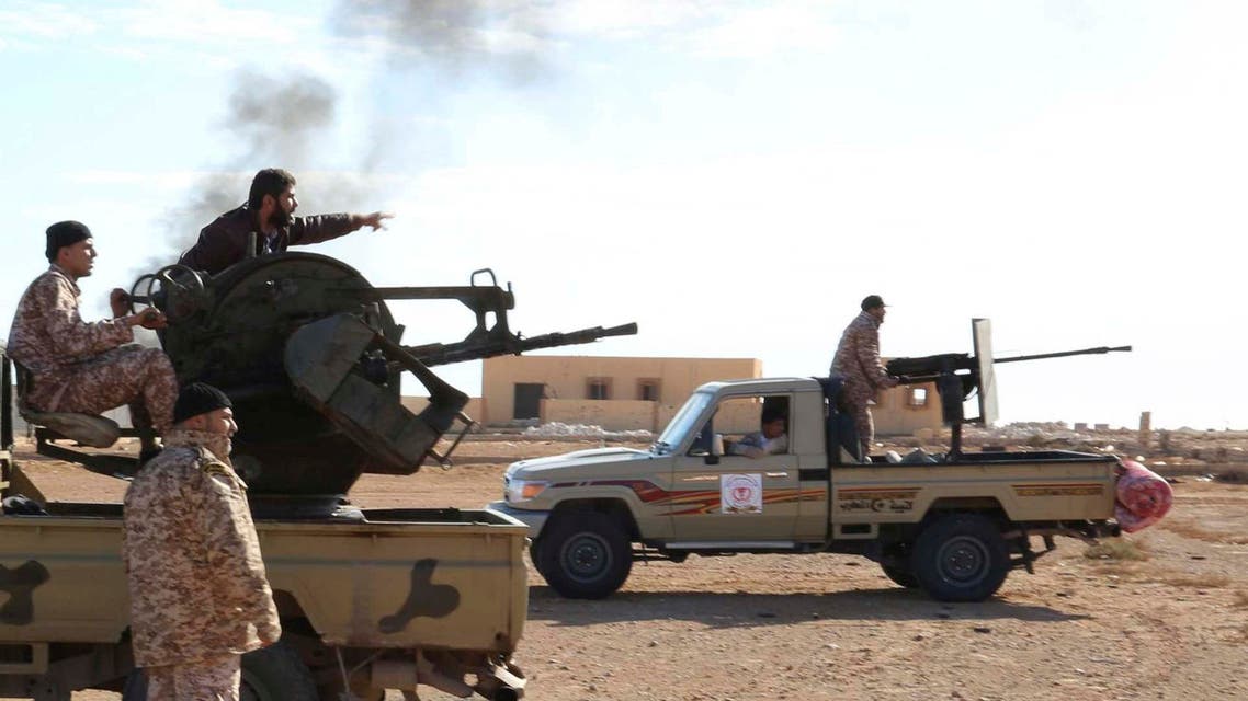 Libyan Army Forces belonging to Libya's rival government, that are part of the Alshorooq (Libya Dawn) operation to free oil ports, fire a vehicle-mounted weapon on the outskirts of Al Sidra oil port December 14 2014. (Reuters)