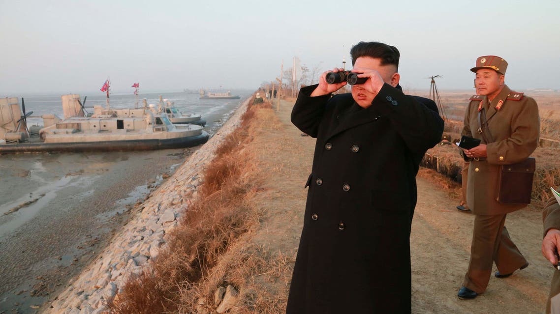 North Korean leader Kim Jong Un looks through a pair of binoculars as he organizes and guides a combined joint drill in this undated photo released by North Korea's Korean Central News Agency (KCNA). (Reuters)