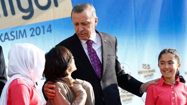 Turkey's President Tayyip Erdogan talks with students of Tevfik Ileri Imam Hatip School during its opening ceremony in Ankara. (File photo: Reuters)