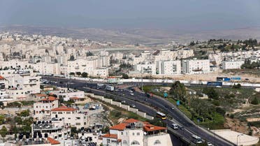 A view of Pisgat Zeev (L), an urban settlement in an area Israel annexed after the 1967 war, and the Arab neighbourhood of Beit Hanina (R) is seen in East Jerusalem December 7, 2014. (File photo: Reuters) settlement palestine