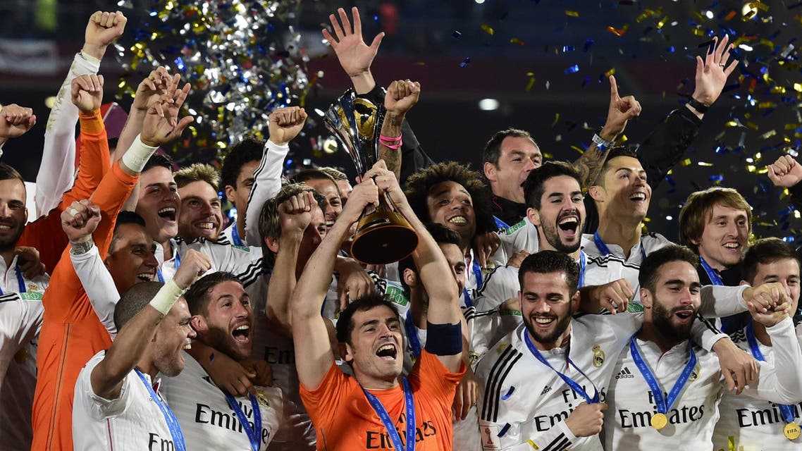 Real Madrid's players celebrate with the trophy after winning the FIFA Club World Cup final football match against San Lorenzo at the Marrakesh stadium in the Moroccan city of Marrakesh on Dec. 20, 2014. (AFP)