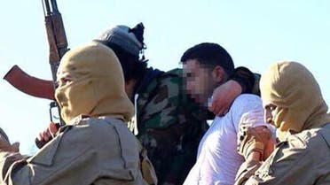 A still image released by the ISIS group's branch in Raqa on jihadist websites on Dec. 24, 2014 purportedly shows a Jordanian pilot captured by IS group's fighters. (AFP)