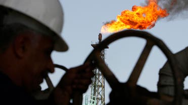 An Iraqi worker opens a pipe at Sheaiba oil refinery in Basra in this March 29, 2007 file photo. REUTERS