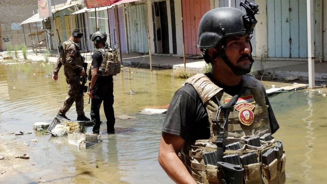 Members of the Sunni anti-Al-Qaeda militia Sahwa (Awakening) patrol a flooded area during operations to fight against ISIS. (File photo: AFP)