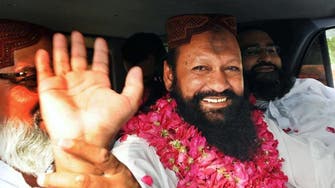 Pakistan extremist leader held for two more weeks in murder case 
