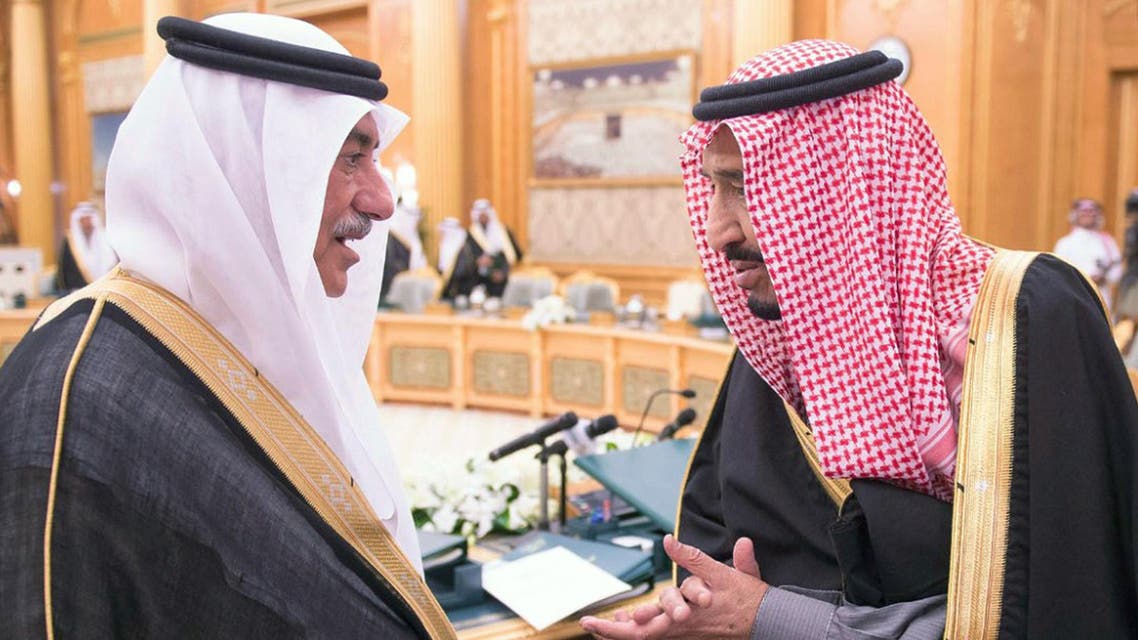 Saudi Crown Prince Salman bin Abdulaziz (R) and Saudi Arabian Finance Minister Ibrahim Al-Assaf talking during a cabinet session in Riyadh to approve the state's budget for 2015.