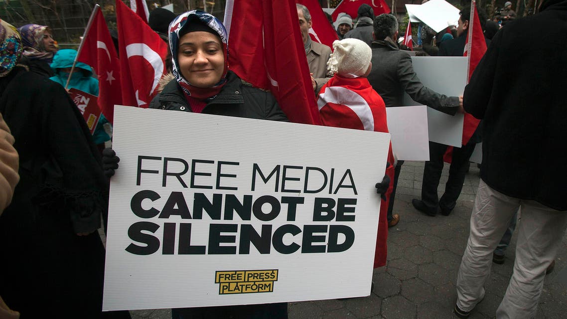 A woman takes part in a protest against the Turkish Government for issuing an arrest warrant for U.S.-based Muslim cleric Fethullah Gulen, in the Manhattan borough of New York, Dec. 20, 2014. (Reuters)