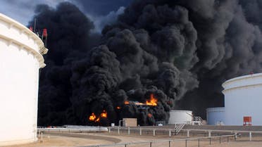 Smoke rises from an oil tank fire in Es Sider port December 26, 2014. (Reuters)
